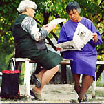ladies reading newspapers